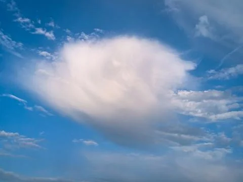 Dramatic cirrus cloud formation with fall streaks with soft wisps and texture Stock Photos