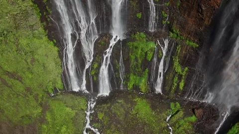 Dramatic Cliff and Water Streams of Tumpak Sewu Waterfall Indonesia Stock Footage 329628259