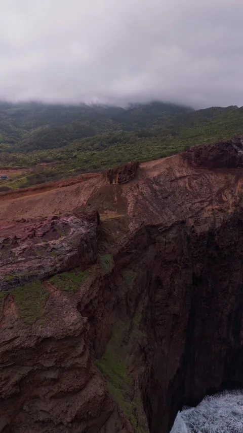 Dramatic Cliff Canyon Vista in Madeira with Misty Mountains and Lush Valleys Stock Footage 333313618