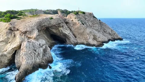 Dramatic Cliff Coastline and Lighthouse Near Cala Ratjada, Mallorca Video stock 304264142