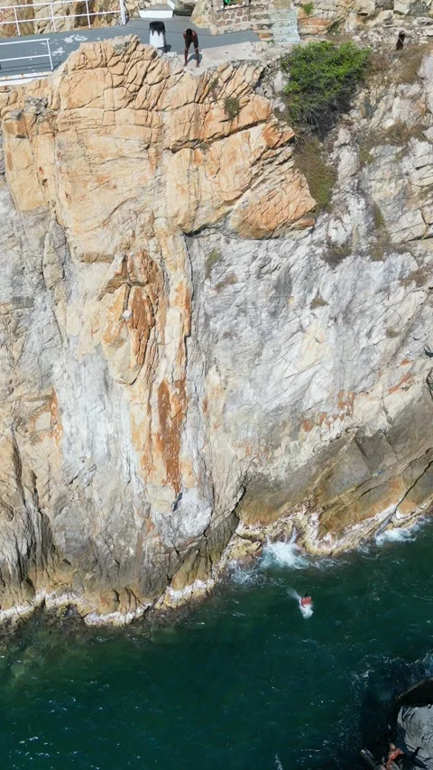 Dramatic Cliff Diving at Acapulco La Quebrada Aerial Drone Footage Stock Footage 333220408