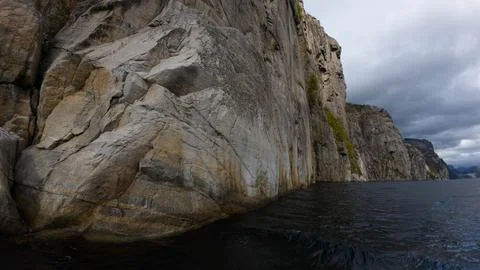 Dramatic Cliff Face Overlooking Choppy Waters Stock Photos