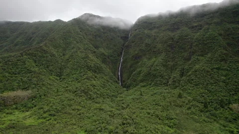 Dramatic cliff with waterfall and mist Reunion Island Stock Footage 317875926