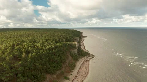 Dramatic cliffs along coastline, aerial view Stock Footage 142667553