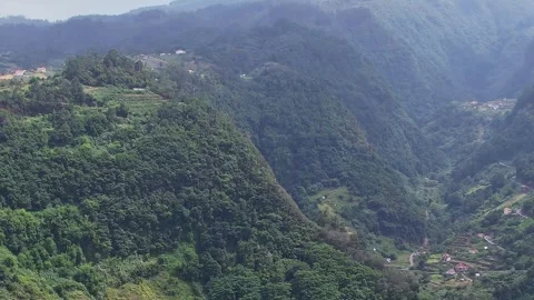 Dramatic cliffs and lush greenery of Madeira Island captured from above Stock Footage 322920840