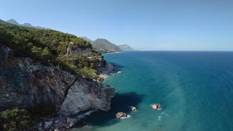 Dramatic Cliffs and Turquoise Sea in Phaselis Bay, Antalya, Turkey Stock Photos