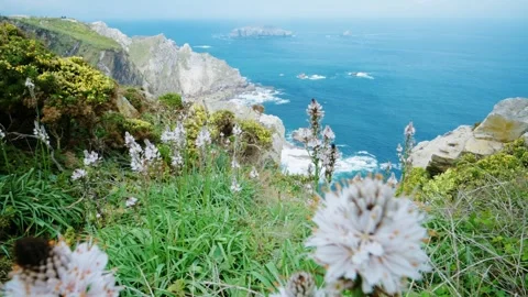 Dramatic cliffs dropping into the blue ocean in Asturias Stock Footage 336491892