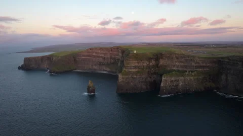 Dramatic Cliffs of Moher at Sunset with Pink Sky in Ireland Stock Footage 331828595