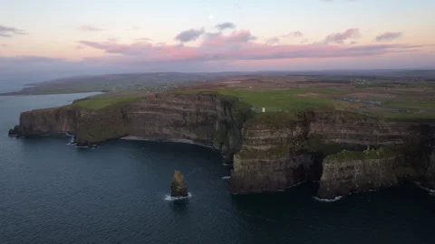 Dramatic Cliffs of Moher at Sunset with Pink Sky in Ireland Stock Footage 331828651