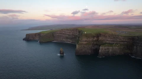 Dramatic Cliffs of Moher at Sunset with Pink Sky in Ireland Stock Footage 331828722