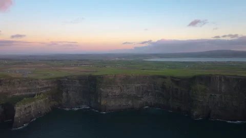 Dramatic Cliffs of Moher at Sunset with Pink Sky in Ireland Stock Footage 331828855