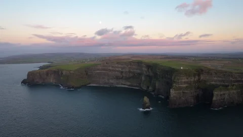 Dramatic Cliffs of Moher at Sunset with Pink Sky in Ireland Stock Footage 331828858