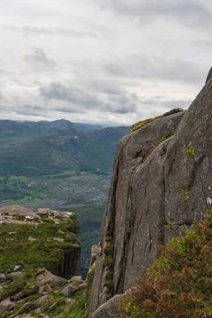 Dramatic Cliffside and Green Valleys in Norway's Mountainous Region Stock Photos