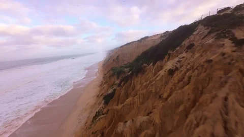 Dramatic cliffside coastline with crashing waves. After the storm Video stock 345149310