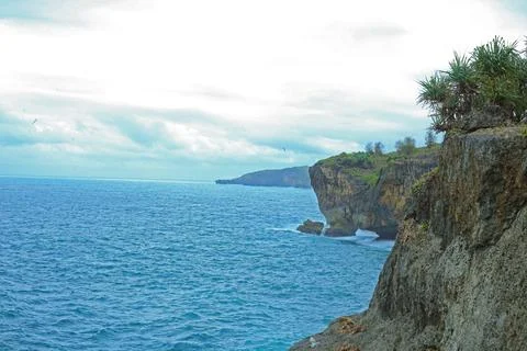 Dramatic Cliffside Ocean View at Sunset Stock Photos