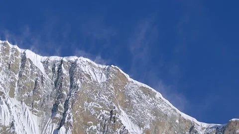 Dramatic close-up of Annapurna's rugged cliff face in Nepal, partially cove.. Stock-Footage 311885764
