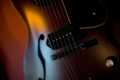 Dramatic close up Electric Guitar on black background Stock Photos