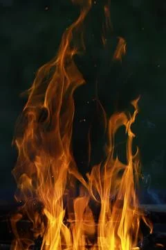 Dramatic Close-Up of Intense Flames Against a Dark Background Stock Photos