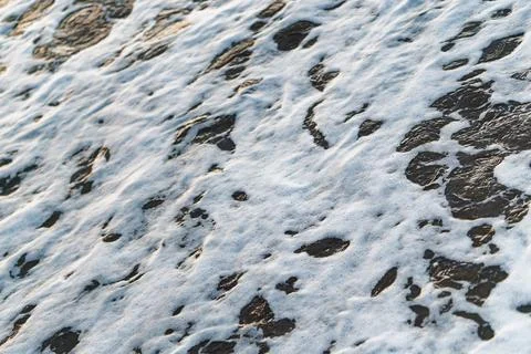 Dramatic Close-Up Of Sea Foam With Foreground Focus Stock-Fotos