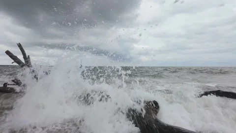 Dramatic close-up of slow motion water spray hitting driftwood, Charleston Stock Footage 318233692