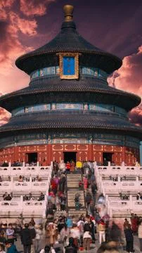 Dramatic close up of Temple of Heaven roof against colorful Beijing evening s Photos