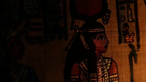 Dramatic Closeup of Old Egyptian Papyrus Artwork Light Passing Stock Footage 75267258