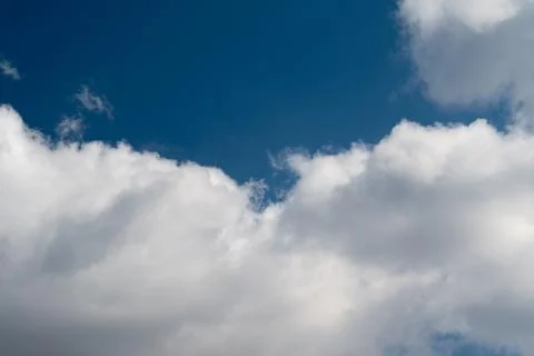 Dramatic cloud bank against deep sky, heavy cumulus layers, brooding tones,.. Stock Photos