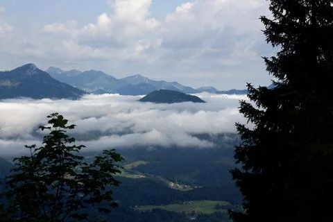 Dramatic cloud cover over the mountains in Tyrol Stock Photos