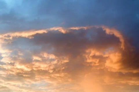 Dramatic cloud on evening sky. Sunset over ocean. Fire in the sky. Stock Photos