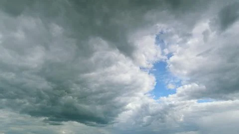 A Dramatic Cloud Formation is observed, interspersed with Breaks of Beautiful Bl 写真素材