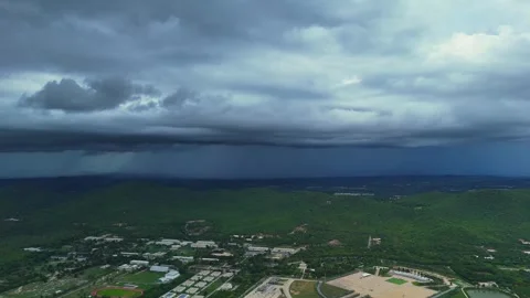 Dramatic cloud formation over green farmland as tropical storm approaches Stock Footage 314358008