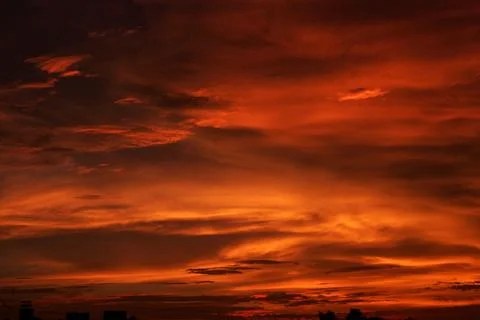 Dramatic cloud formation red orange color just before sunrise, Pune, Mahara.. Stock Photos