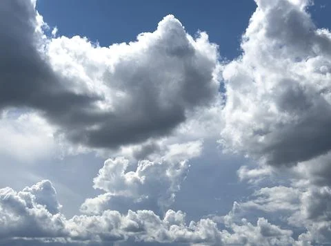 Dramatic cloud formation spreads across sky with strong contrast. Billowing 스톡 사진