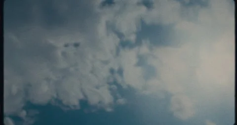 Dramatic Cloud Formations Against A Blue Sky viewed through a Bottle Stock Footage 301442058