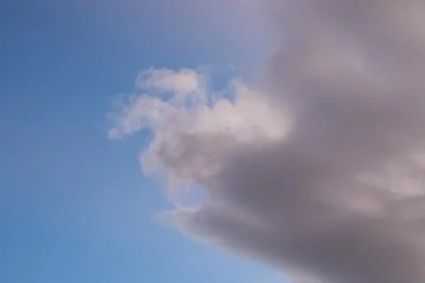 Dramatic Cloud Formations Against Blue Sky Stock Photos