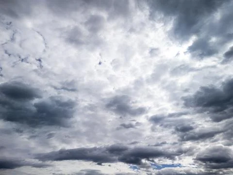 Dramatic cloud formations in a blue sky with varied shades and textures, Stock Photos