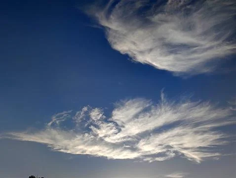 Dramatic cloud formations in blue sky 写真素材