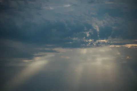 Dramatic cloud formations with rays of sunlight breaking through the overca.. Stock Photos