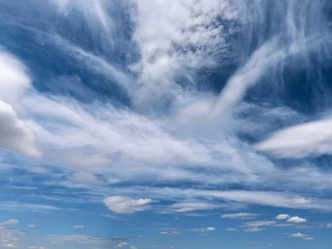 Dramatic Cloud Layers Above Blue Summer Landscape Stock Photos