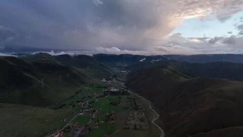 Dramatic Cloud Opening Above Mountain Settlement in Sichuan, China Stock Footage 344034964