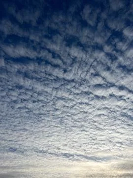 Dramatic Cloud Patterns in a Bright Blue Sky, Capturing Natures Beauty Essence Stock Photos