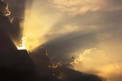 Dramatic cloud sunset time with sunbeams Stock Photos