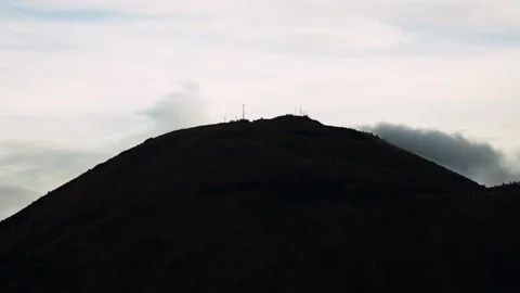 Dramatic Cloud Timelapse Over Dark Mountain Peak, Cinematic Nature Motion Video stock 345897131