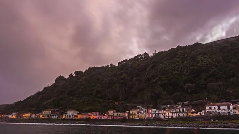 Dramatic Cloud Timelapse, Sicilian Coastal Town, pink, orange, grey sky. Stock Footage 253152787