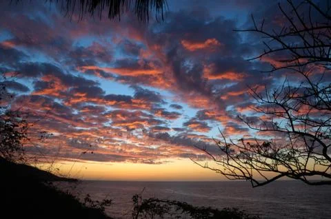 Dramatic clouded sky of Banderas Bay Pacific ocean view in sunset light Stock Photos