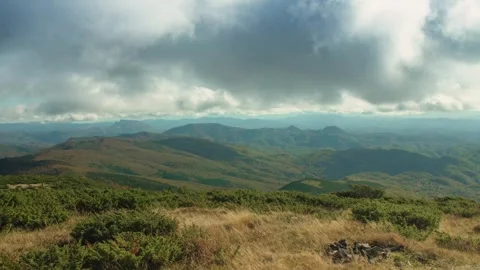 Dramatic clouds above green mountains Timelapse Stock Footage 297903409