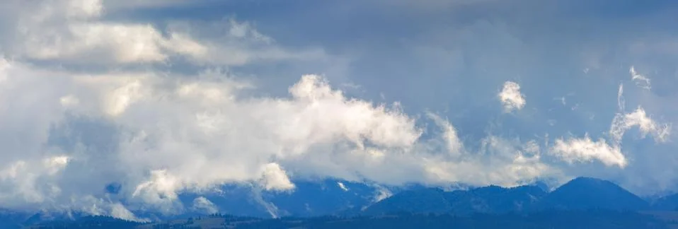 Dramatic clouds above the mountain ridge Stock Photos