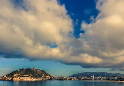Dramatic clouds above San Sebastian in the late afternoon Stock Photos