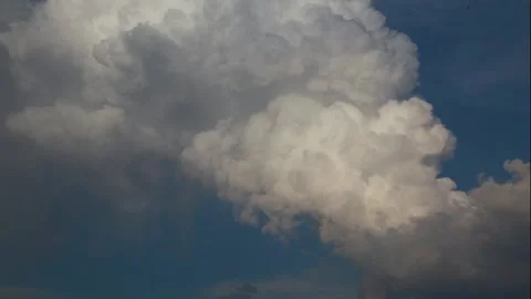 Dramatic clouds against a vibrant blue sky Stock Footage 316599020