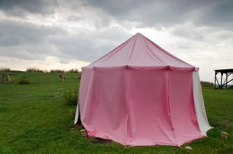 Dramatic clouds and an ancient camp, restored from medieval time Stock Photos